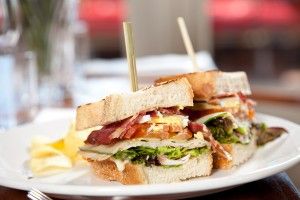 Gourmet prosciutto, smoked cheese and egg club sandwich