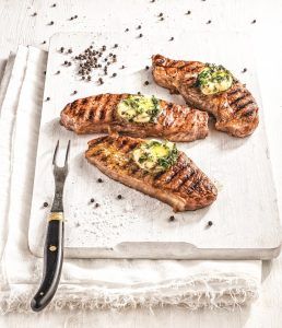 Garlic-herb butter beef steaks