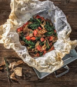 Wild mushrooms and greens in parchment