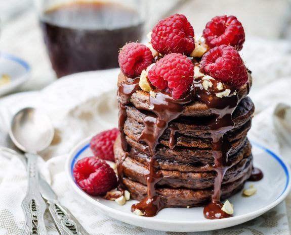 chocolate pancake with bananas, raspberries, nuts and chocolate