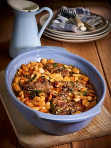 Roast pork neck with beans and peppers