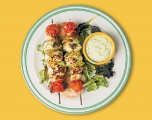 Chicken souvlaki with haloumi and tomato