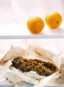 Baked sea bream with orange and raisins