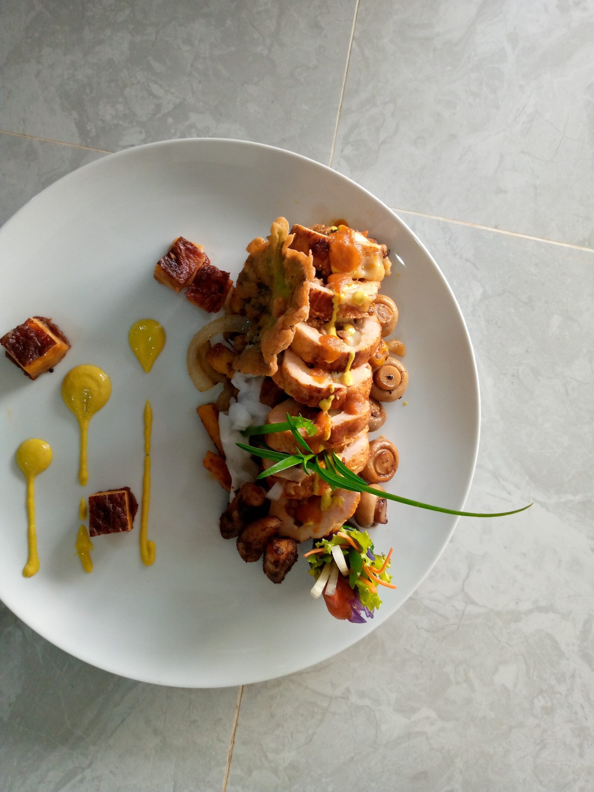 Chicken,Ballotine,Served,With,Gratin,,Coconut,And,Some,Veggies,Spotted