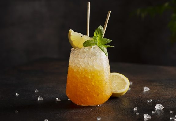cocktail with crushed ice, lemon and mint
