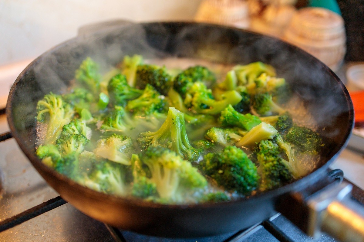 broccoli stew in a cast iron pan close-up