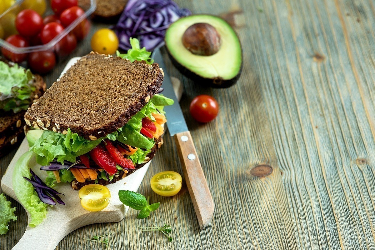 Vegan rye wholegrain fresh sandwich with ingredients for healthy