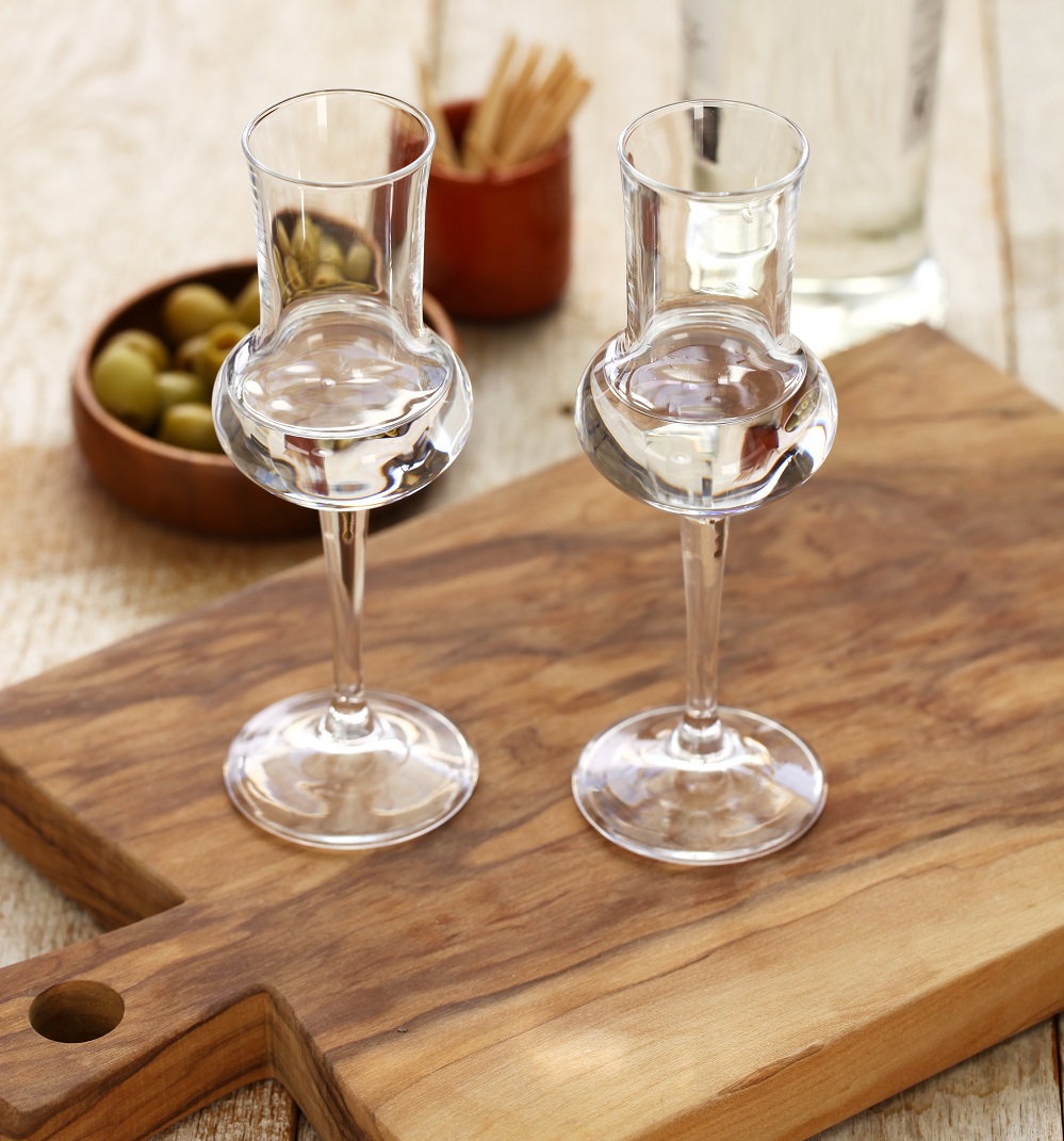 two glasses of Grappa bianca italian digestif, grape-based pomace brandy