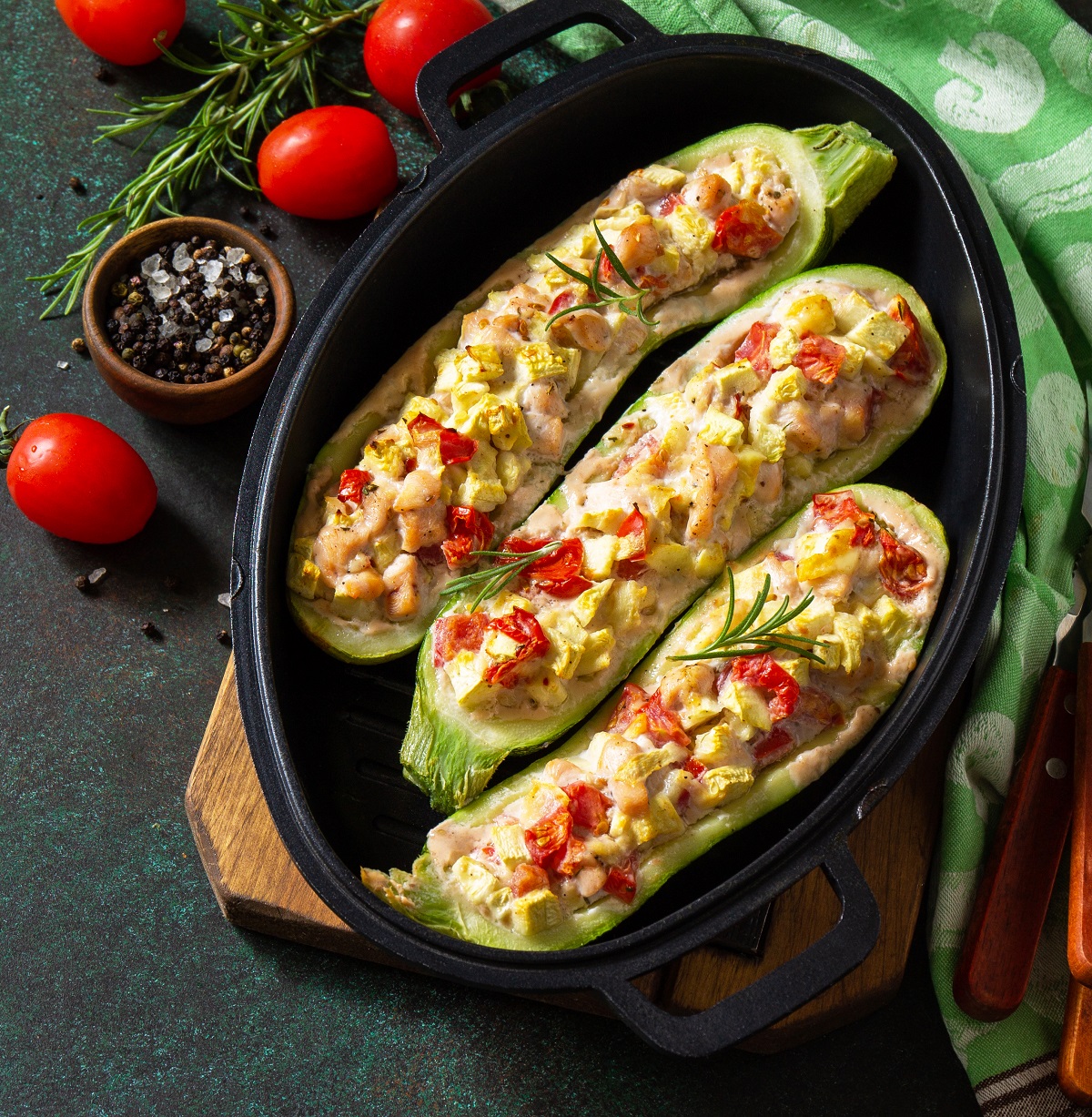 Healthy food. Baked zucchini stuffed with meat and tomatoes in a