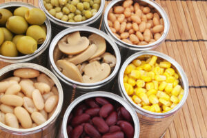Preserved,Food,On,Bamboo,Background.canned,Green,Peas,,Beans,,Corn,,Olives