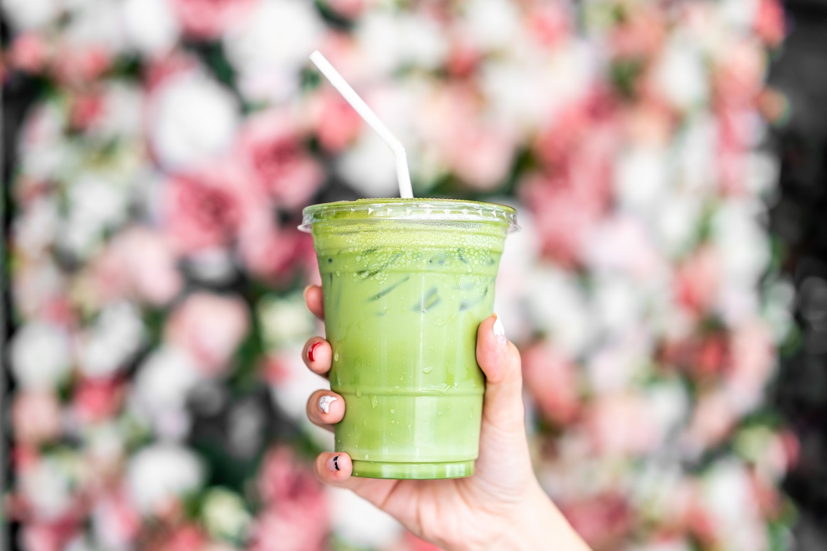 Close-up,Hand,Holding,Iced,Matcha,Latte,Green,Tea,Cup