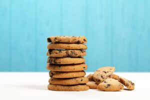 Cookies,With,Chocolate,Chips,On,A,Blue,Background