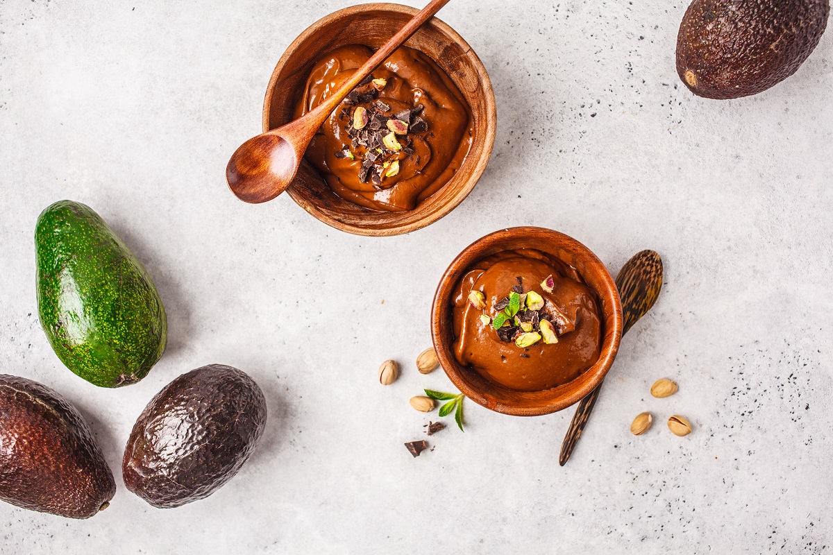 Avocado,Chocolate,Mousse,With,Pistachios,In,A,Wooden,Bowl,On