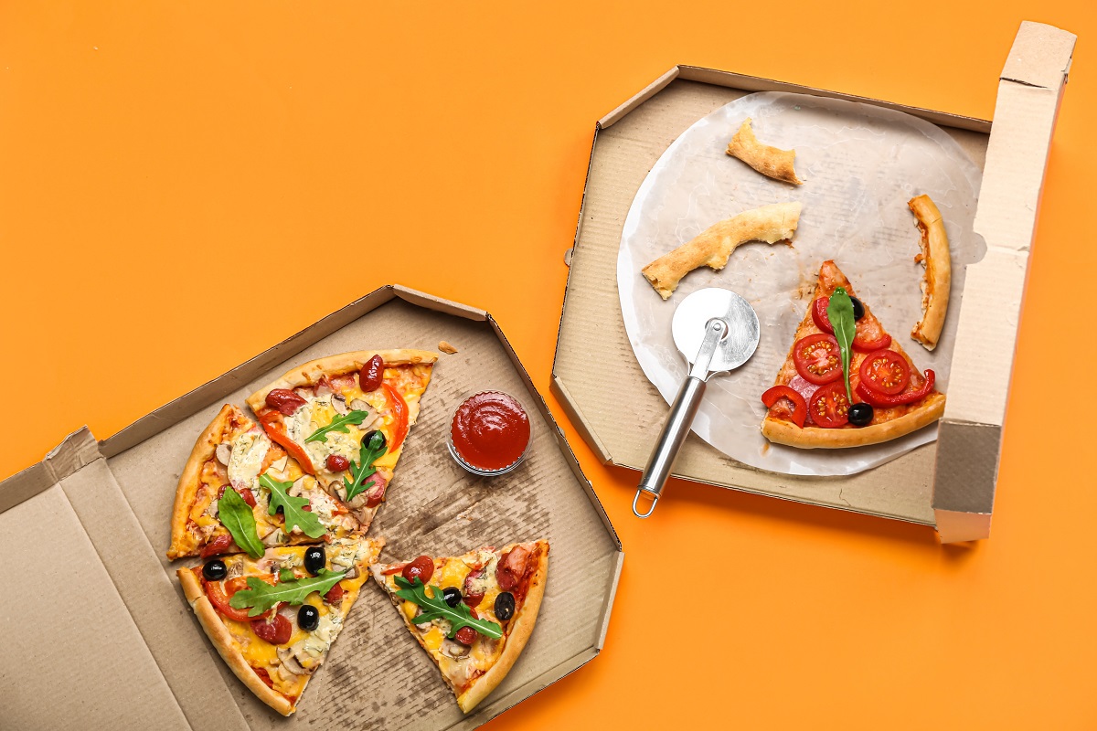 Cardboard,Boxes,With,Tasty,Pizza,And,Leftovers,On,Color,Background
