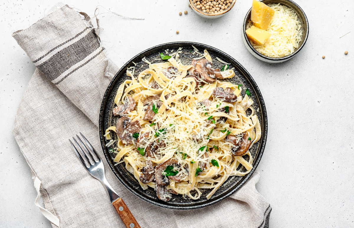 Prepared,Pasta,With,Mushrooms,With,Parsley,And,Cheese,On,Grey