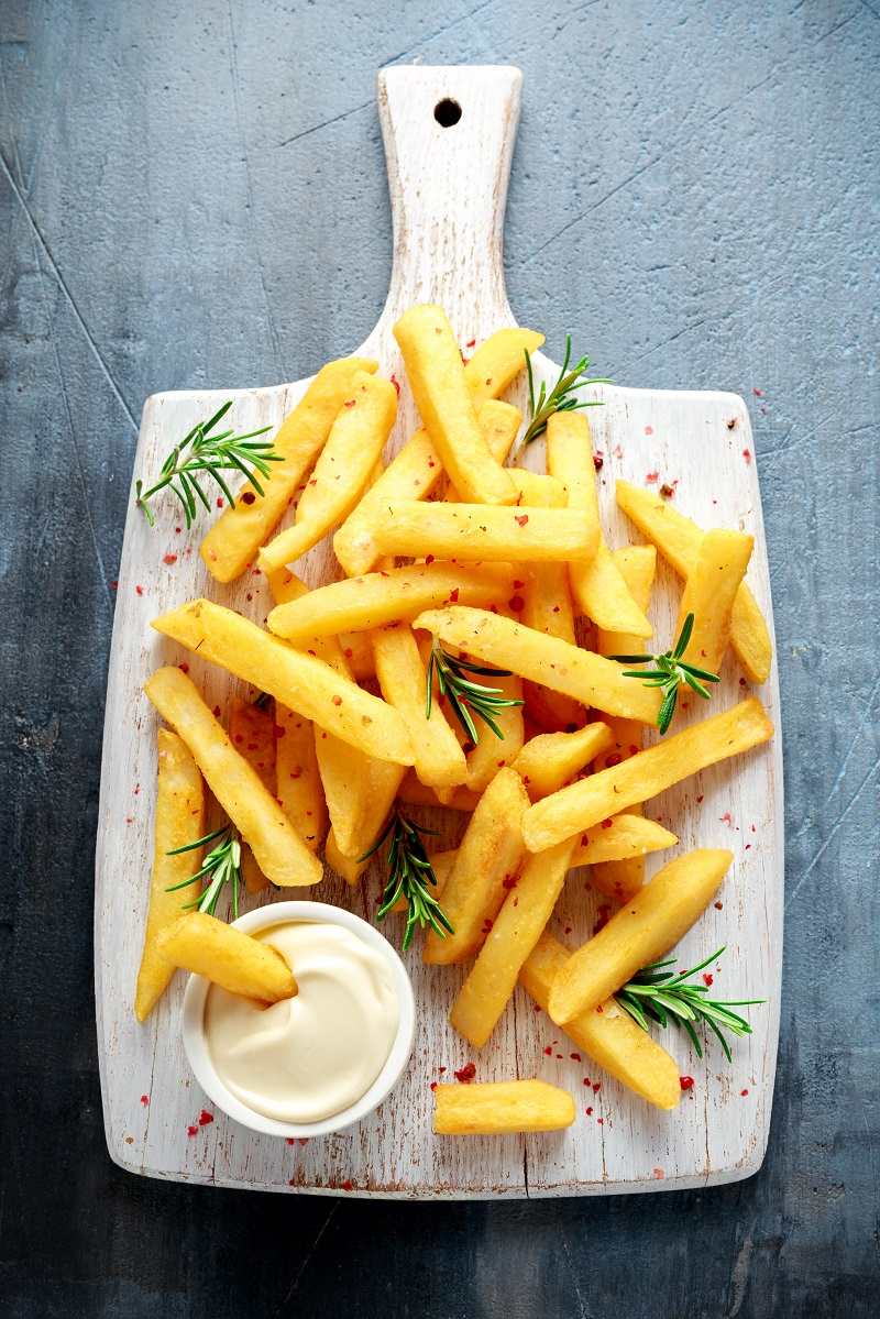 Homemade,Baked,Potato,Fries,With,Mayonnaise,And,Rosemary,On,White