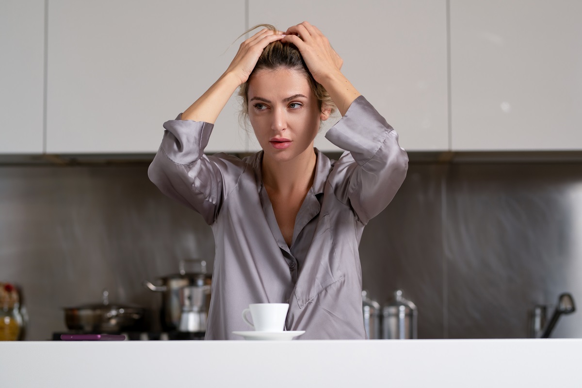 Depressed,Woman,In,The,Kitchen,In,The,Morning.