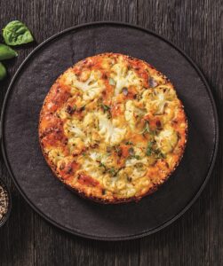 Cauliflower Cake with cheese, basil, top view