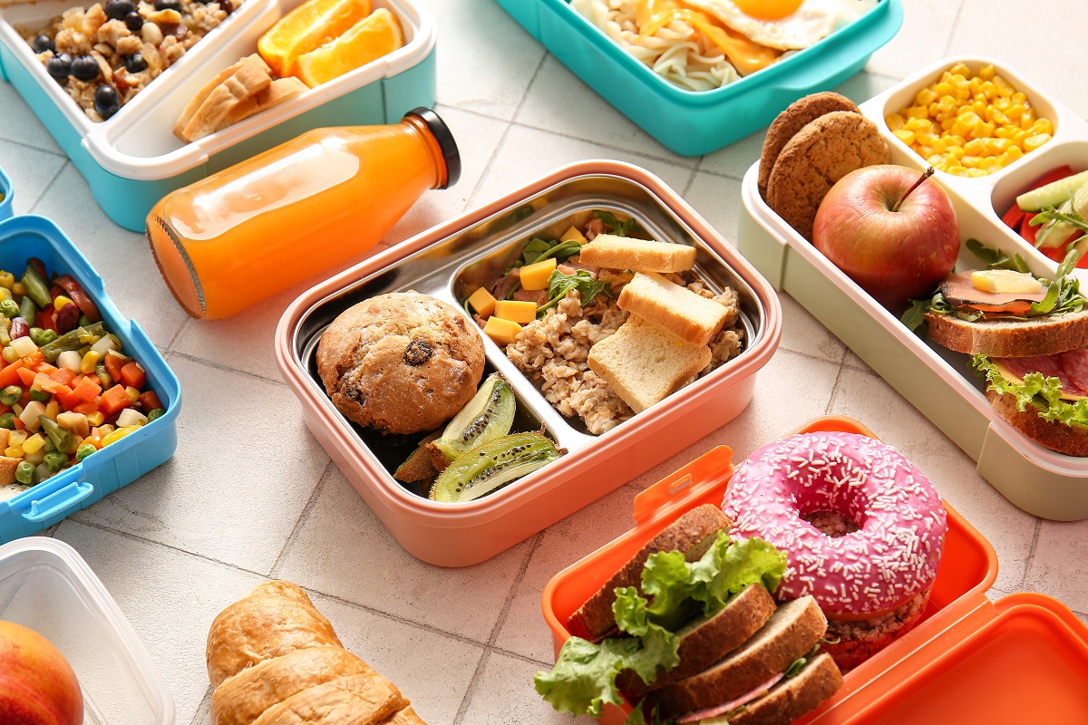 Many,Lunchboxes,With,Different,Delicious,Food,And,Bottle,Of,Juice