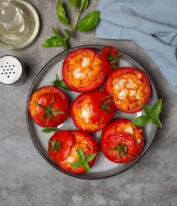 Baked,Stuffed,Tomatoes,With,Rice,And,Cheese.,Top,View.,Grey