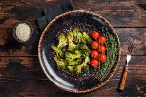 Grilled,Roasted,Broccoli,Cabbage,With,Herbs,On,Plate.,Wooden,Background.