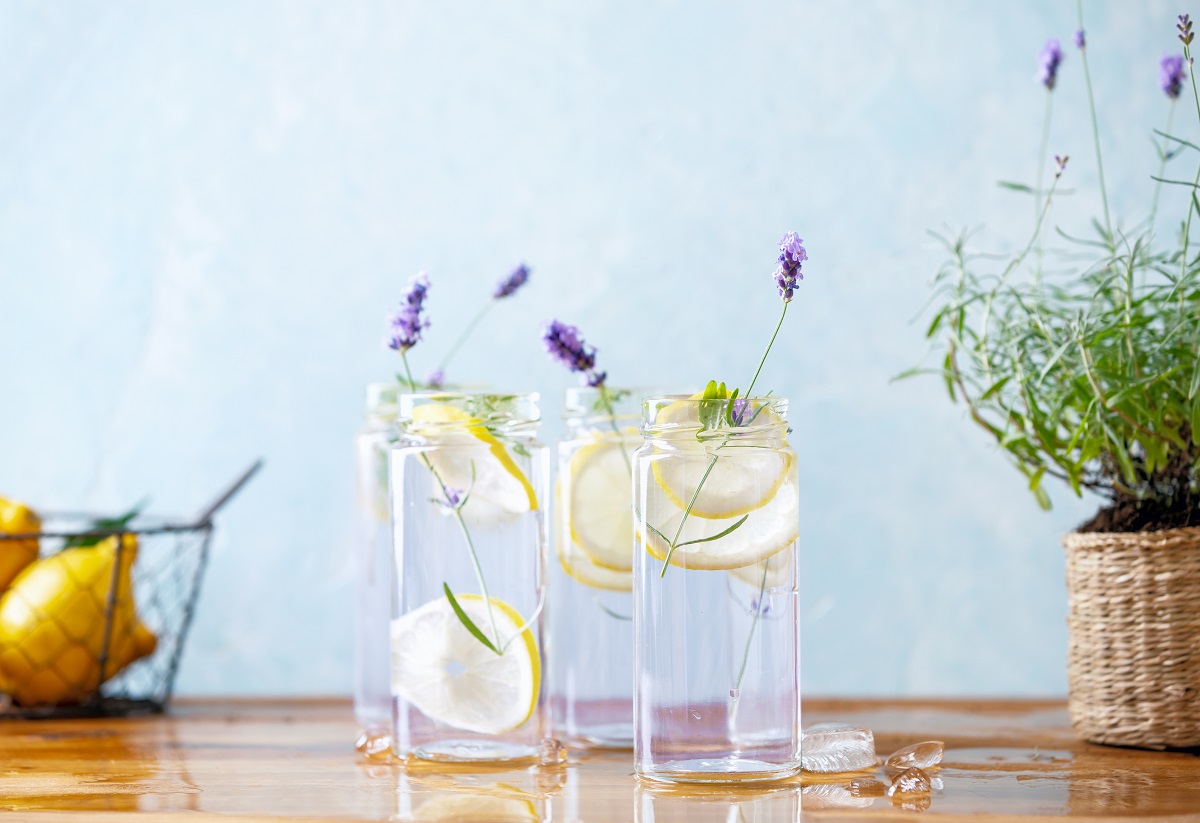 Lavender,Lemonade,In,Glass,Jars,Standing,On,A,Wooden,Table,