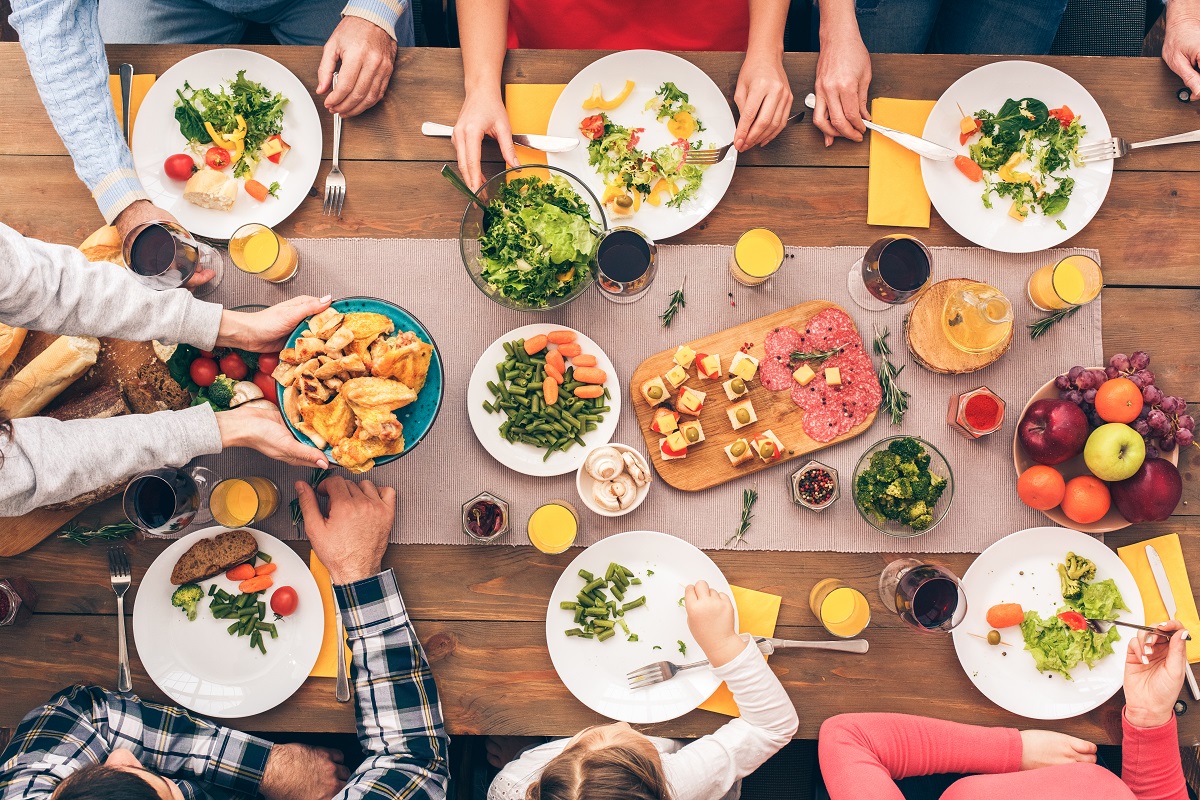 Family,Sitting,At,Home,,Eating,Food,Together