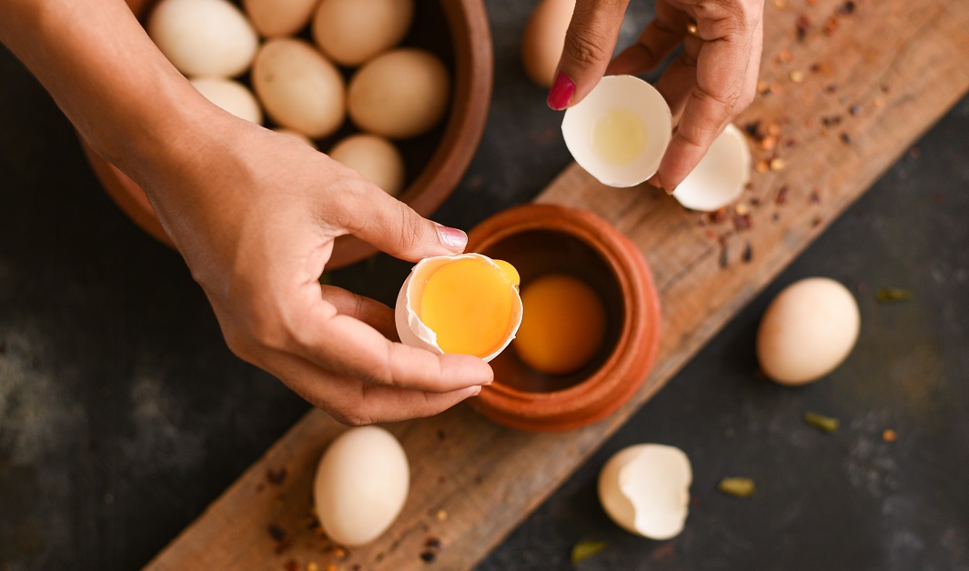 Raw,Organic,Farm,Eggs,Kerala,India.,A,Girl,Breaking,Chicken