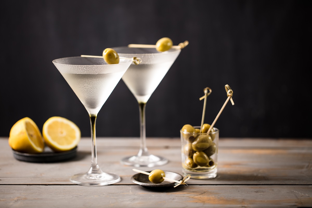 Martini,Cocktail,On,Wooden,Worktop.,Olive,Garnish.,Space,For,Text