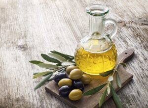 Olive,Oil,And,Olive,Branch,On,The,Wooden,Table