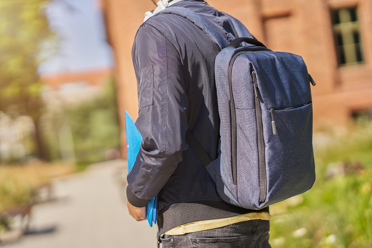 Back,Midsection,Of,Male,Student,In,The,Campus