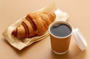 Takeaway,Coffee,In,Paper,Cup,With,Croissant.,Coffee,Break,Background.