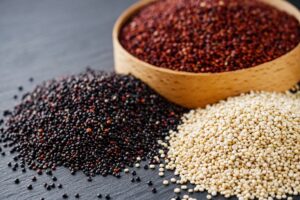 Tricolor,Quinoa,Seeds,On,A,Dark,Rustic,Background.