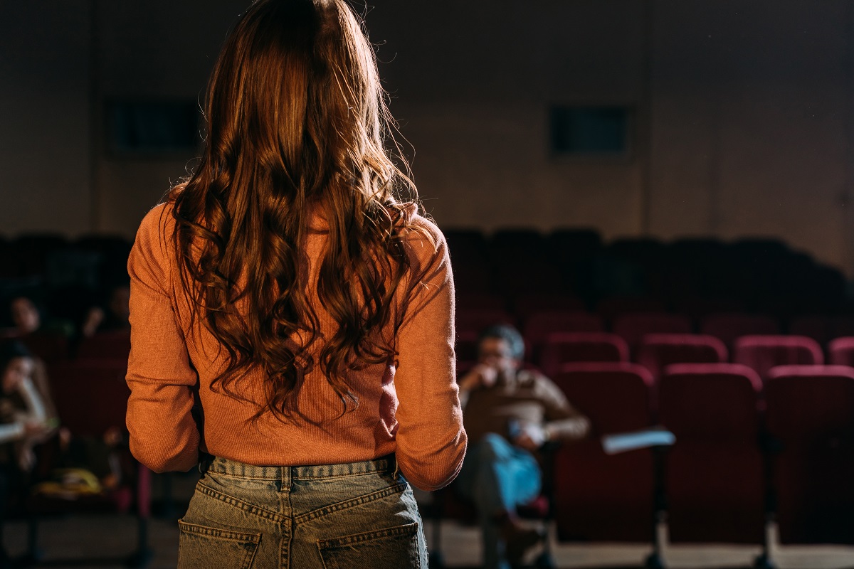 Back,View,Of,Actress,And,Stage,Director,In,Theater