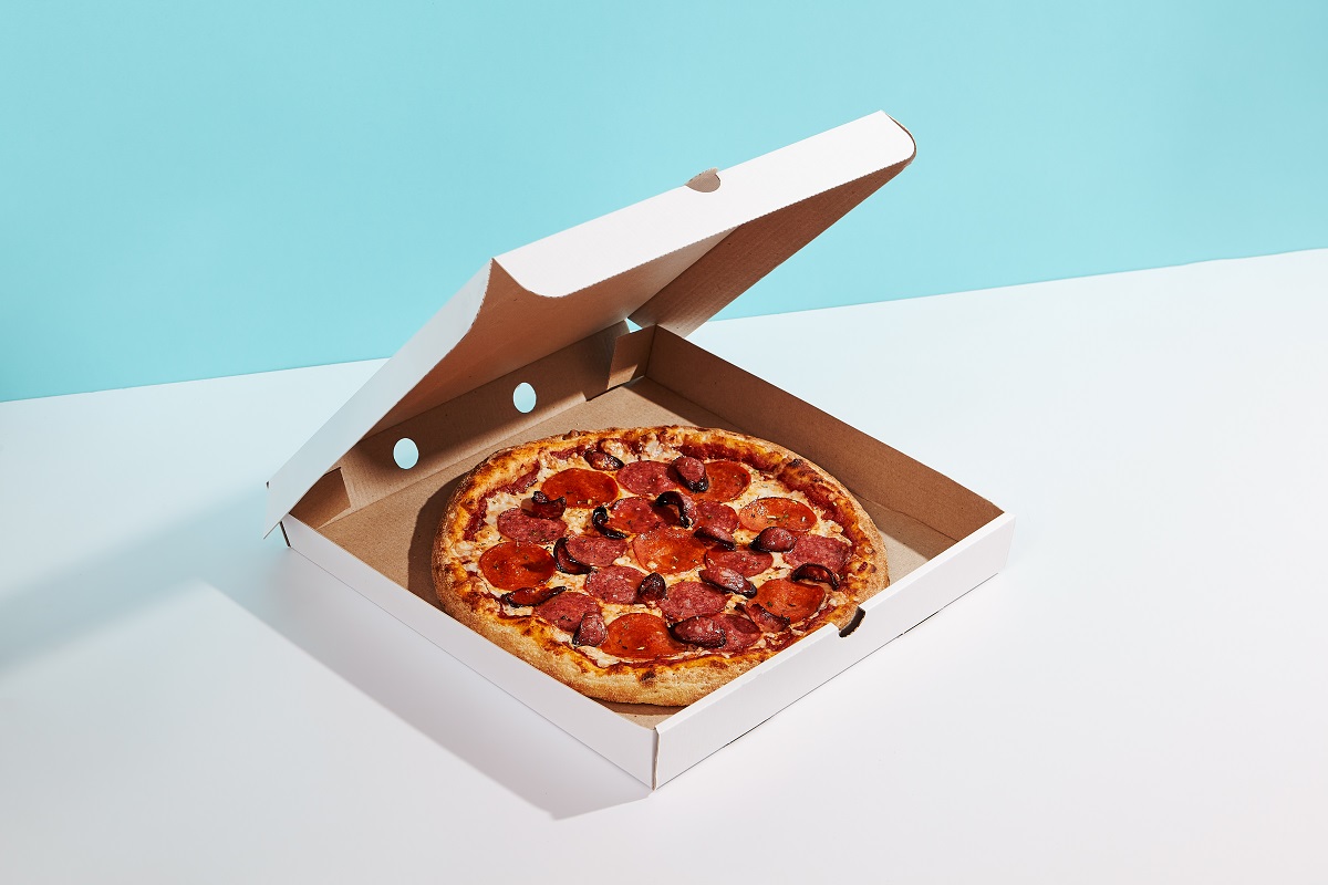 Italian,Pizza,In,Paper,Box,On,Coloured,Background.,Meat,Pizza