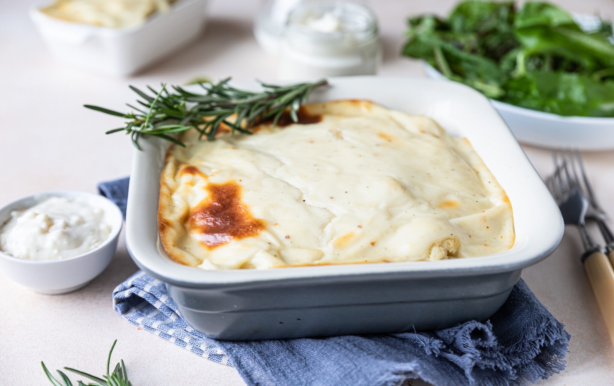 Cauliflower,Gratin,With,Chicken,And,Bechamel,Sauce,Decorated,With,Rosemary