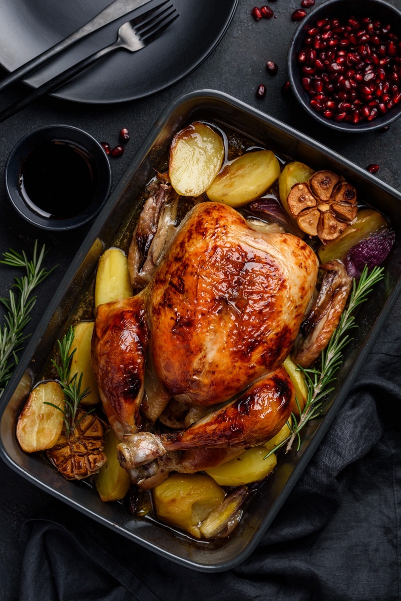 Roasted,Chicken,In,Pomegranate,Sauce,With,Potatoes,In,A,Gray