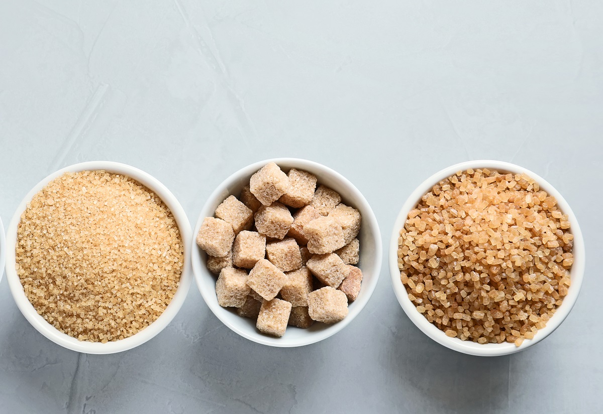 Bowls,With,Different,Types,Of,Sugar,On,Gray,Background