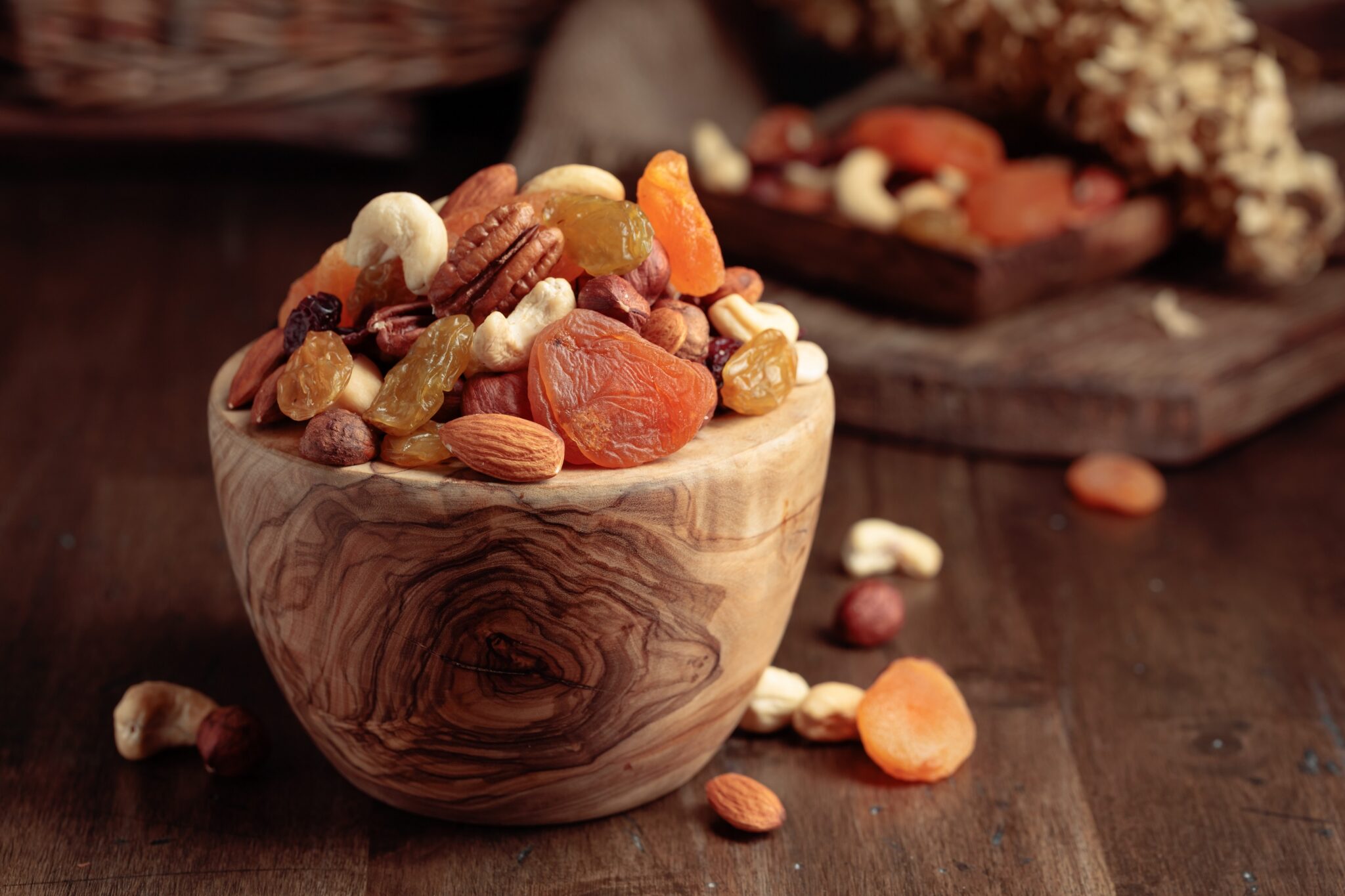 Dried,Fruits,And,Assorted,Nuts,On,An,Old,Wooden,Table.