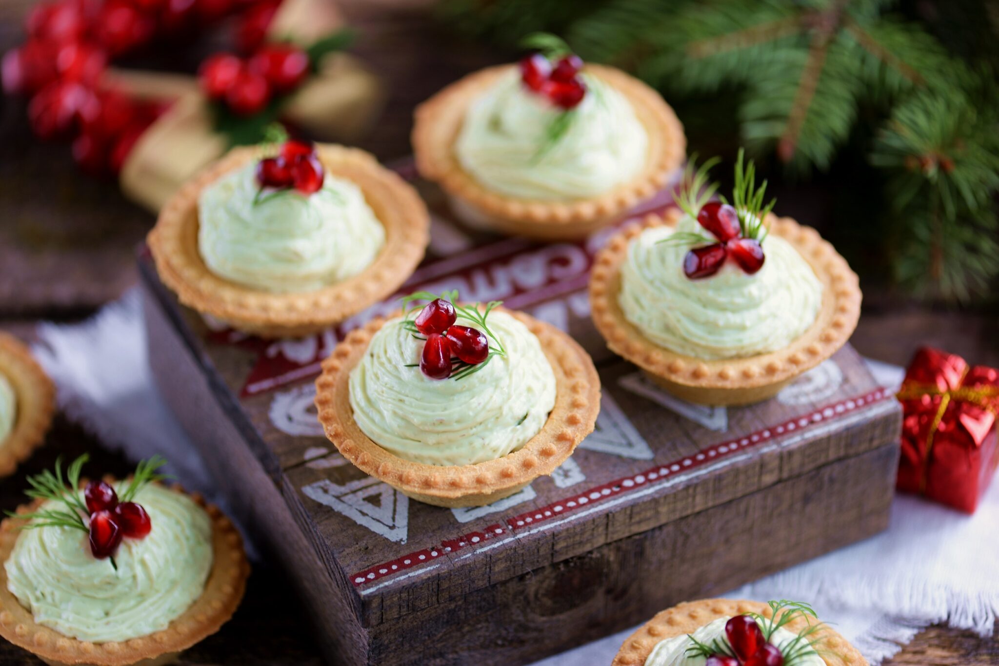 Tartlets,With,Avocado,Pasta,,Cottage,Cheese,,Fish,Caviar,And,Pomegranate.