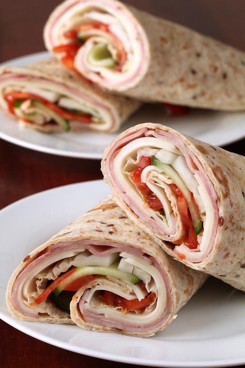 Wholemeal,Tortillas,With,Ham,,Cheese,,Tomatoes,,Cucumber,And,Cabbage