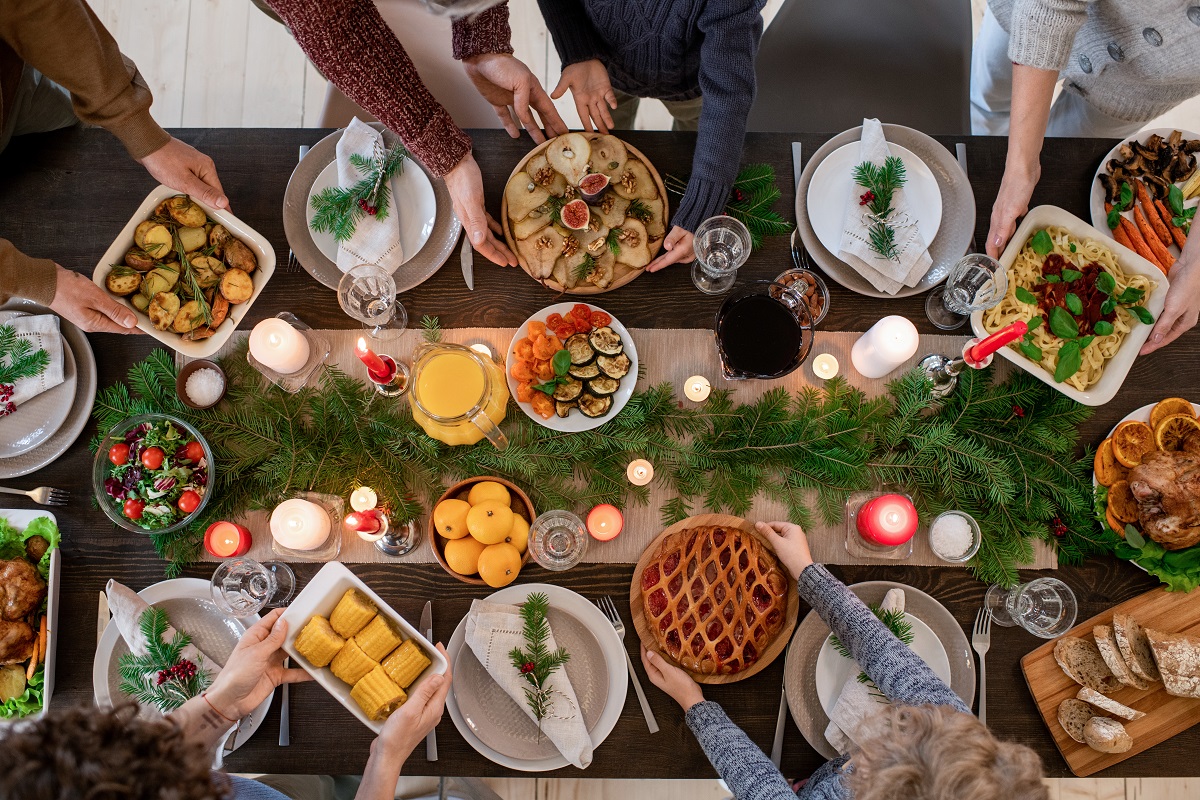 Top,View,Of,Hands,Of,Family,Members,Holding,Plates,With