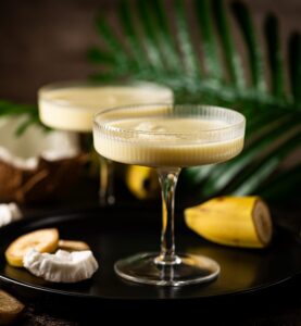 Banana,Cocktail,With,Coconut,Milk,In,A,Glass,On,Dark