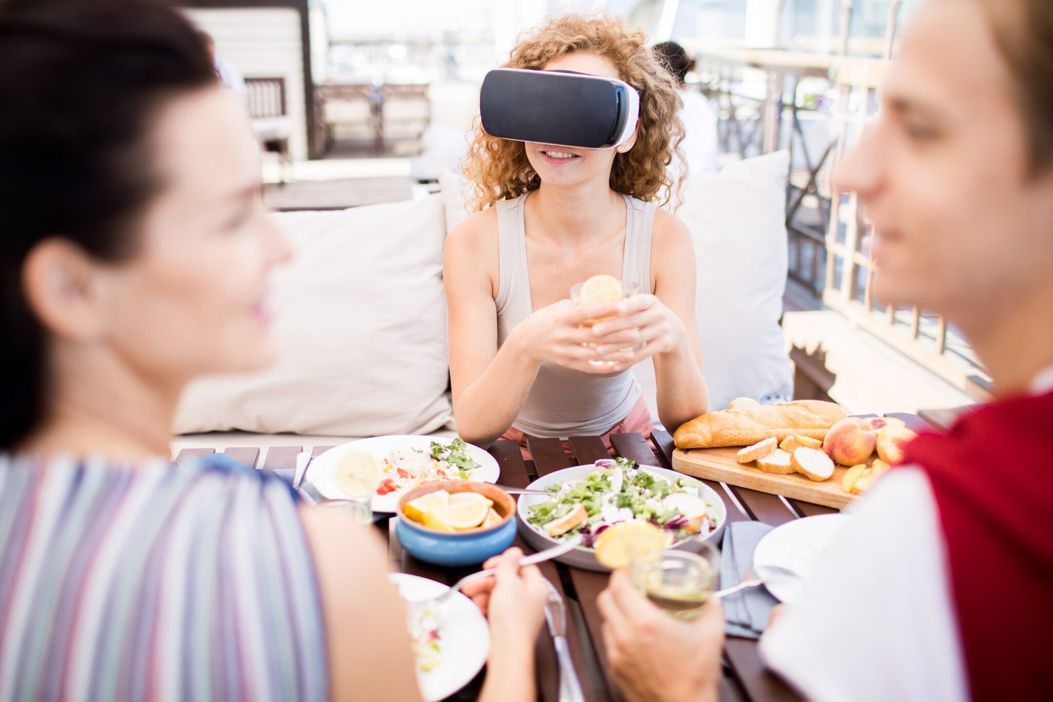 Young,Woman,In,Vr,Goggles,And,Her,Friends,Discussing,News