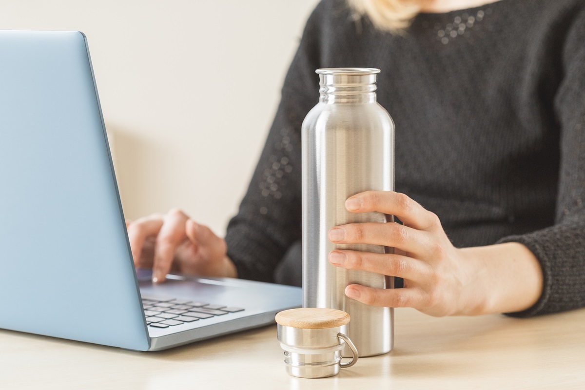 White,Woman,Holding,Her,Personal,Stainless,Steel,Water,Bottle,On