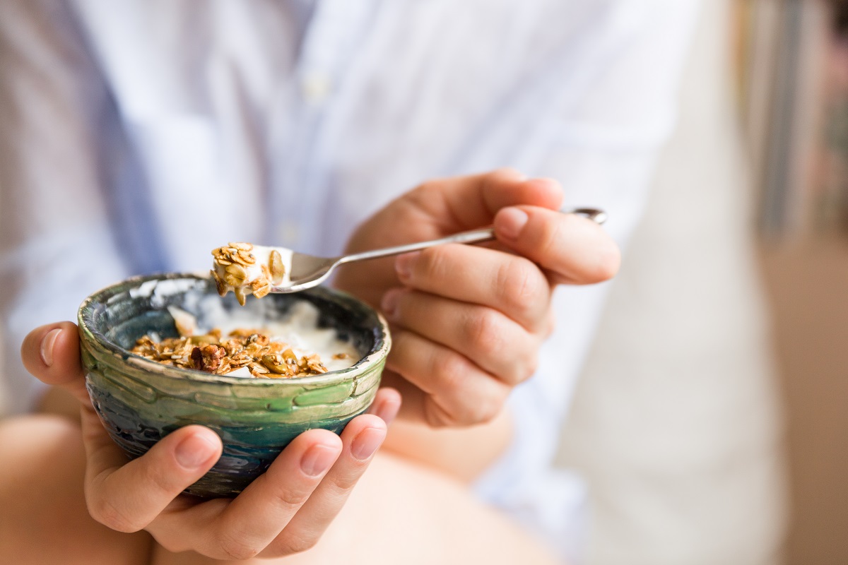 Young,Woman,With,Muesli,Bowl.,Girl,Eating,Breakfast,Cereals,With