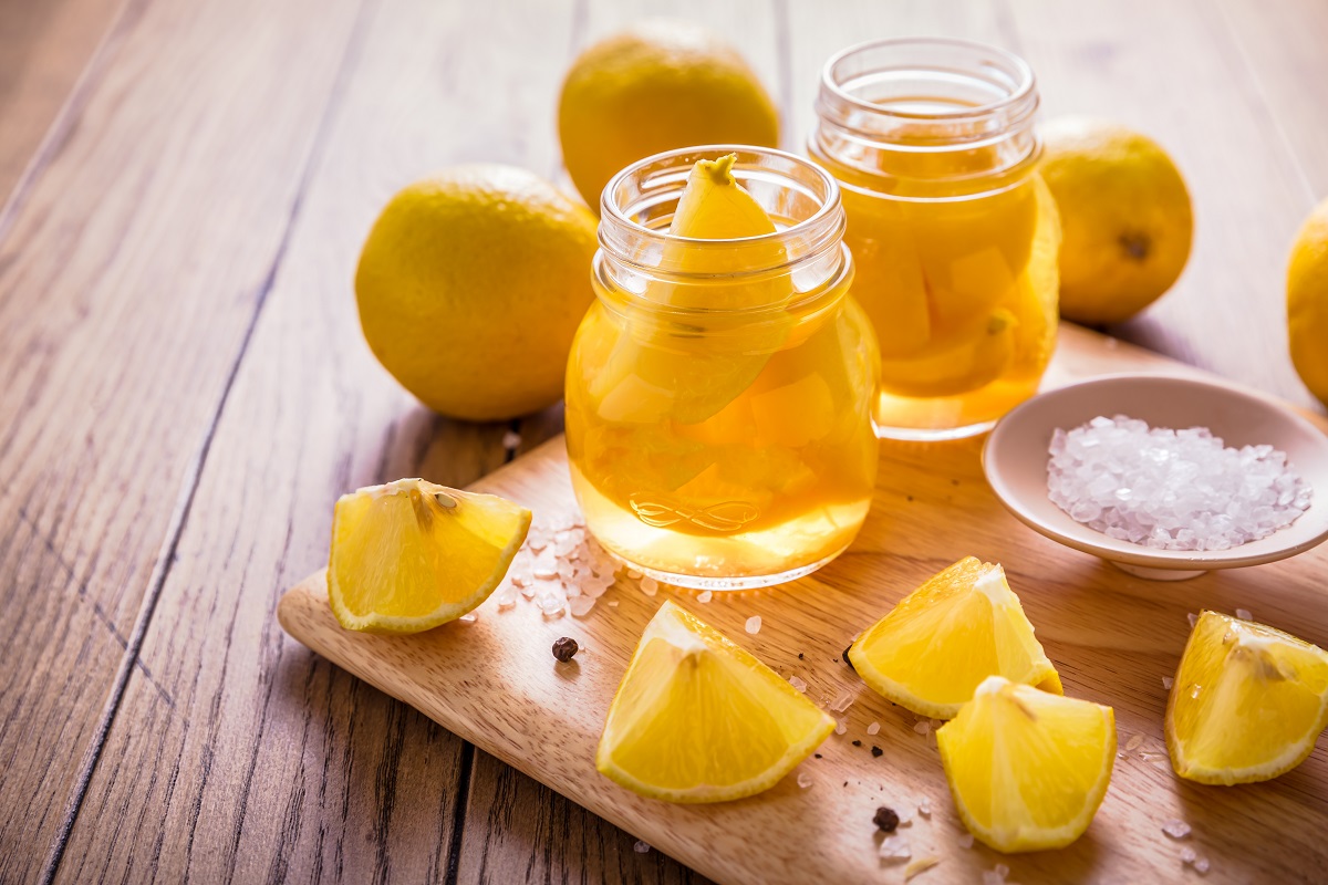Preserved,,Salted,Canned,Lemons,,Lemon,Pickle,On,Wooden,Background.,Moroccan