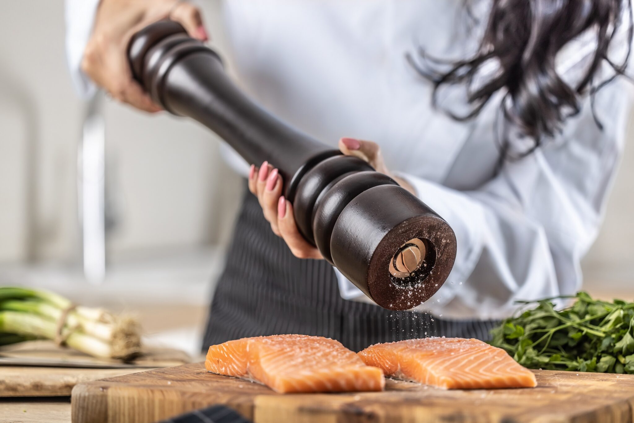 A,Salt,Grinder,Is,Used,By,A,Chef,To,Season