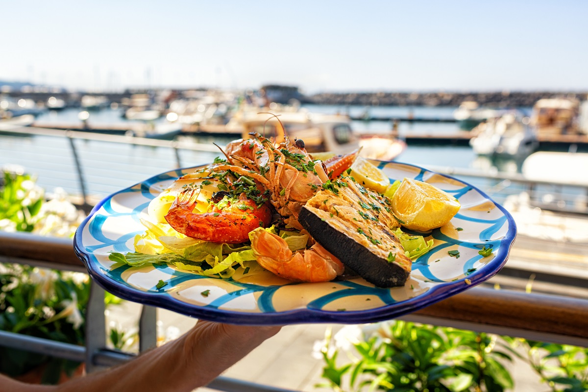 Serving,Seafood,And,Fish,Lunch,In,Sea,Coast,Restaurant,,Sicily,