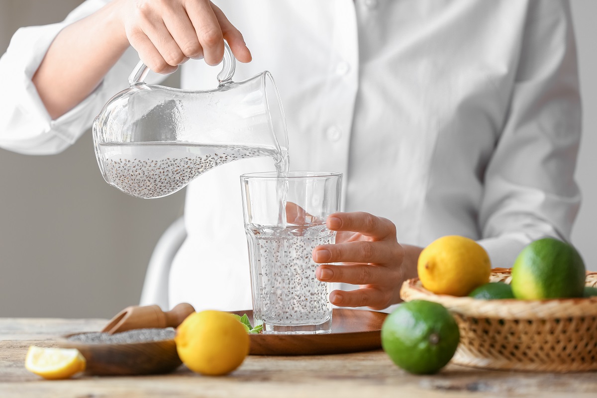 Woman,Pouring,Drink,With,Chia,Seeds,Into,Glass